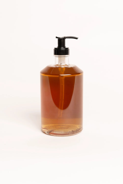 Vue arrière du flacon-pompe transparent de savon mains Pine Heartwood de Hetkinen